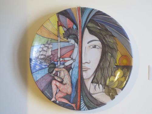 a stained glass window on a wall in a bathroom at La Carretteria Guest house in Mistretta