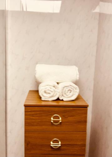 two towels on top of a dresser in a bathroom at The Danescourt in Blackpool