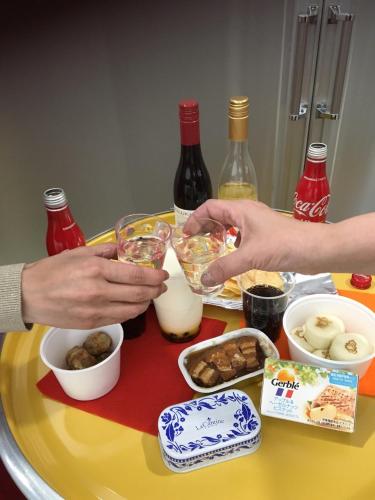 a group of people preparing food on a table at Guesthouse La Cava women's single room / Vacation STAY 21865 in Yokohama