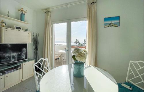 A television and/or entertainment centre at Nice Apartment In La Manga With Wifi
