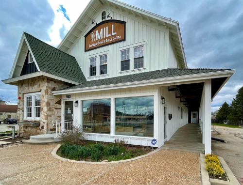 a large white building with a sign on it at 201 -Single Queen in Waunakee