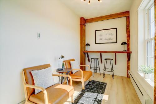 a living room with chairs and a table at 203 - Double Queen in Waunakee