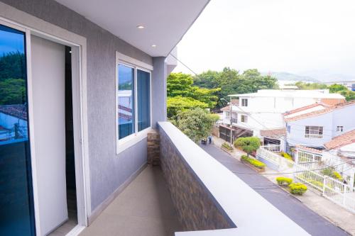 an apartment balcony with a view of a street at Aparta suite tequendama in Cali