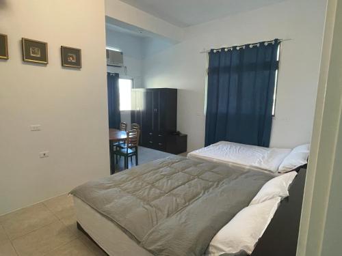 Una cama o camas en una habitación de 阿布の家