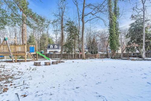 a playground in a yard covered in snow at Private Single Family Home Close to Both Water and Downtown! in Annapolis