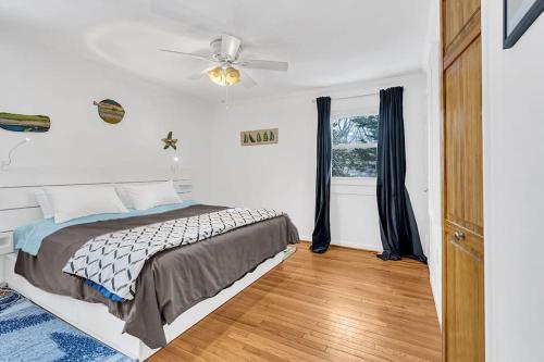 a bedroom with a bed and a ceiling fan at Private Single Family Home Close to Both Water and Downtown! in Annapolis