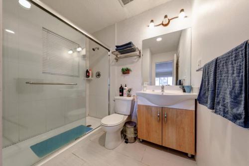 a bathroom with a sink and a toilet and a shower at Private Suite with Separated Entrance Monica's Home in Richmond