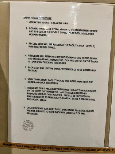 a letter on a clipboard with a document on it at Paragon Residence 8-12pax-Big Balcony with BBQ in Johor Bahru