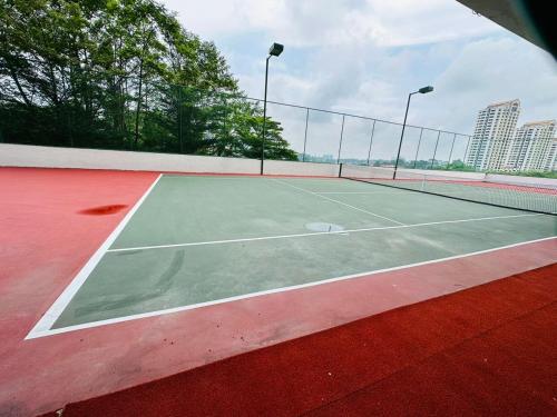 a tennis court with a net on top of it at Paragon Residence 8-12pax-Big Balcony with BBQ in Johor Bahru