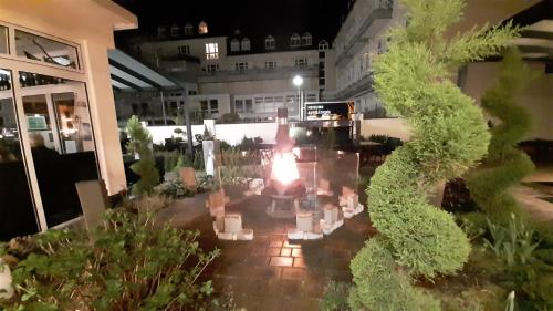 a view of a garden in a building at night at Hotel Krupp in Bad Neuenahr-Ahrweiler