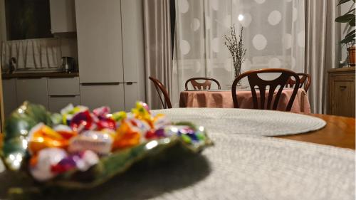 a table with a plate of food on a table at Spokojny Wypoczynek 5 in Ostrów Wielkopolski