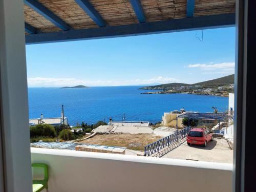 a view of the ocean from a balcony at Aigaio View Studios & Rooms in Azolimnos