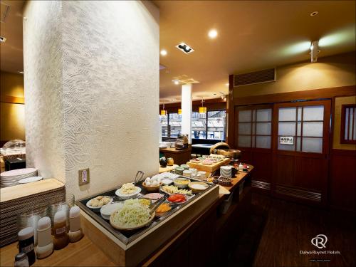 a buffet line with many different types of food at Daiwa Roynet Hotel Kawasaki in Kawasaki
