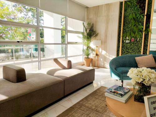 a living room with a couch and a chair at 21st floor The Loop Condo Studio in Cagayan de Oro City Lucky 14 in Cagayan de Oro
