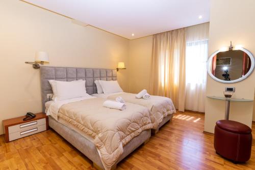 Postel nebo postele na pokoji v ubytování Hotel Brilant Saranda