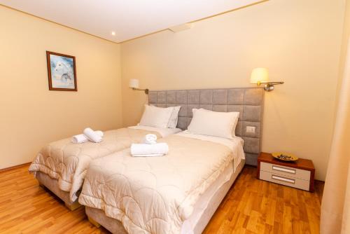 Postel nebo postele na pokoji v ubytování Hotel Brilant Saranda