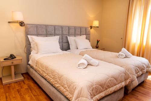 Postel nebo postele na pokoji v ubytování Hotel Brilant Saranda