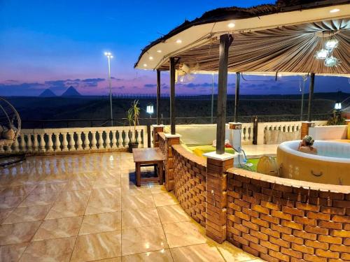 Kép Private Oasis Panoramic Pyramids View RelaxJacuzzi szállásáról ‘Ezbet `Abd el-Ḥamîd városában a galériában