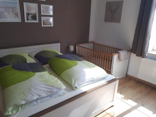Postel nebo postele na pokoji v ubytování Ferienwohnung auf einem Gutshof