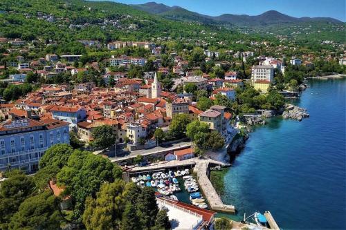 an aerial view of a small town on the water at Apartments Lovro in Lovran