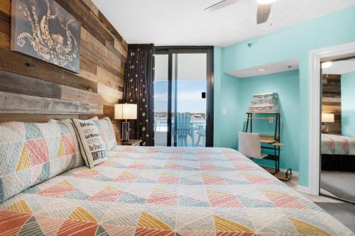 a bedroom with a bed with a wooden wall at East Pass 208 in Destin