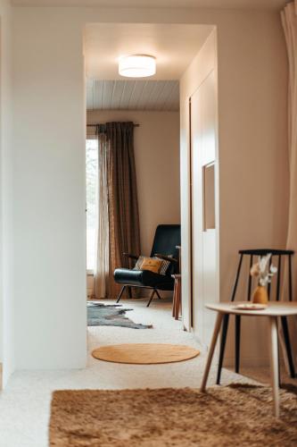 a living room with a couch and a table at le chalet de Plainpalais in Les Déserts