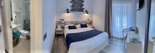 a bedroom with a bed and a bathroom at Hotel Bella Dolores in Lloret de Mar