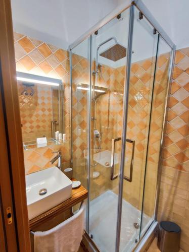 a bathroom with a shower and a sink at A casa di Chiara Salerno in Salerno