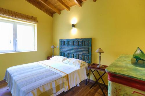 Postel nebo postele na pokoji v ubytování Fede - Danilia Cottages