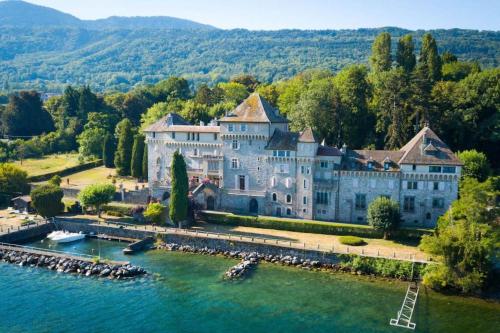 an aerial view of a large building on the water at Cabana & Nuit de Château au bord du Lac Léman in Lugrin