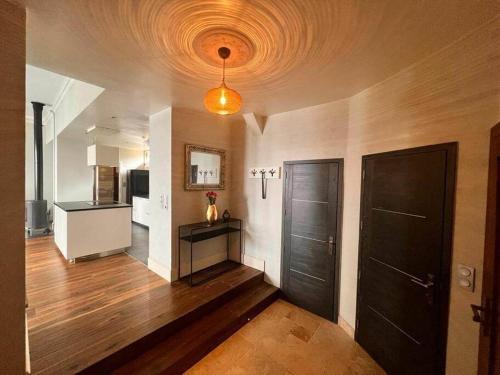 a large room with a kitchen and a living room at Cabana & Nuit de Château au bord du Lac Léman in Lugrin