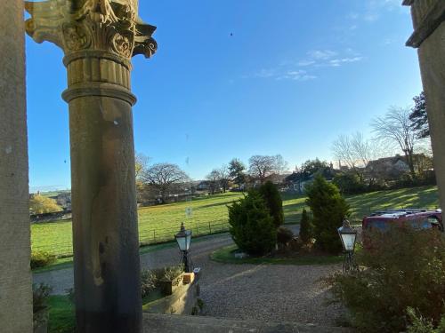 a pole with lights on the side of a street at Bellfield Country Suites in Masham