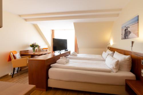 מיטה או מיטות בחדר ב-Hotel Atlantic Juist