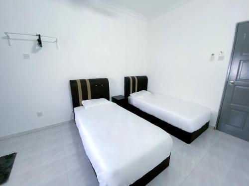 Katil atau katil-katil dalam bilik di Venice Guest Hostel - Bilik Sahaja