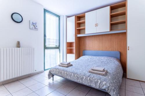Postel nebo postele na pokoji v ubytování Casa dei fiori monolocale