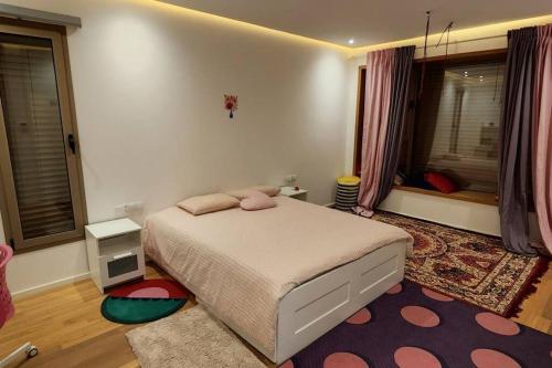 Giường trong phòng chung tại Villa moderne avenue M6