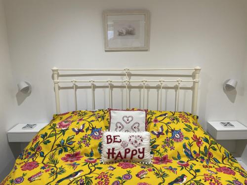 Ένα ή περισσότερα κρεβάτια σε δωμάτιο στο Rivulet Cottage