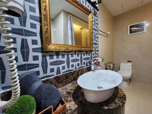 a bathroom with a sink and a mirror at Lagoon View With Balcony 1-5pax Sunway Resort Netflix in Petaling Jaya