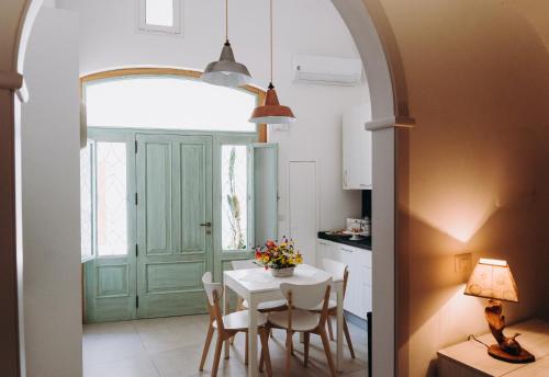 a kitchen and dining room with a table and chairs at Mare Adesso in Polignano a Mare