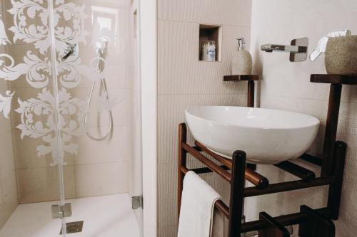 a bathroom with a sink and a shower at Mare Adesso in Polignano a Mare