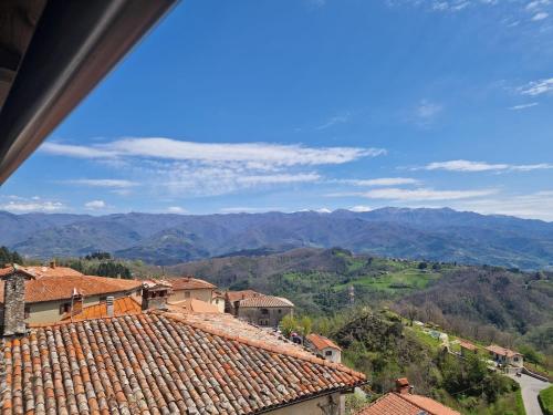 a view of the mountains from the roofs of houses at Casetta della chiocciola in Sassi