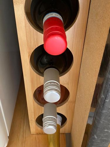 a bottle of wine in a wooden box at Drummond Neuk - Pets Welcome free, country setting, free onsite parking in Inverness