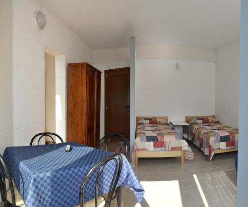 Postel nebo postele na pokoji v ubytování Camping Villaggio Paradiso
