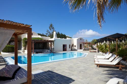 a villa with a swimming pool and a resort at Aquaria Villa in Karterados