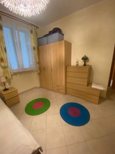 a room with two rugs on the floor in a bedroom at Bed and Breakfast Elisa in Sonnino