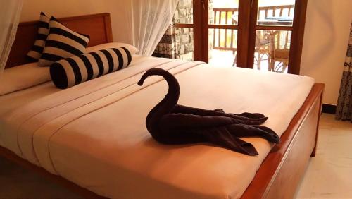 Postel nebo postele na pokoji v ubytování Marvellous Inn