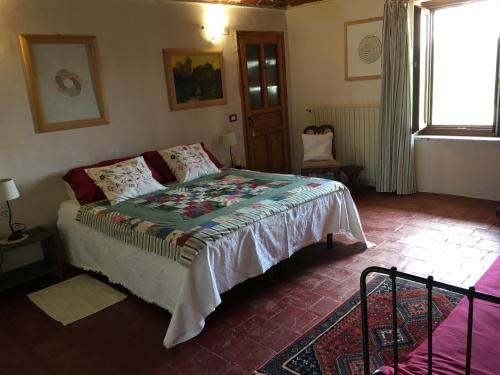 Katil atau katil-katil dalam bilik di B&B Cascina Dei Levrieri