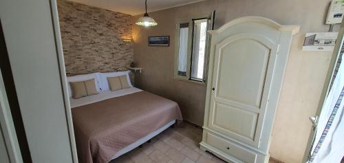 Ένα ή περισσότερα κρεβάτια σε δωμάτιο στο Casa vacanze "Il Carrubo"