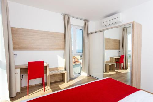 Posteľ alebo postele v izbe v ubytovaní Apartments Villa Ankora