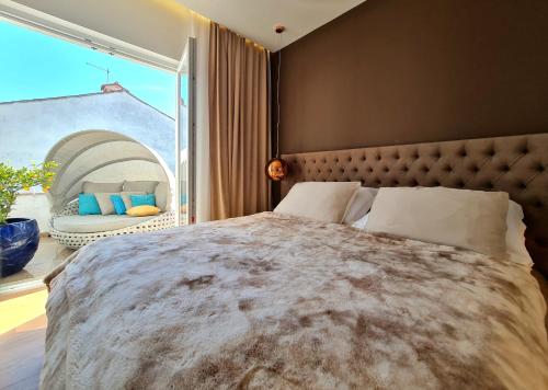 a bedroom with a large bed with a large window at NEW!!! 2024 MAREA apartments with XXL Sunny Terrace in Poreč